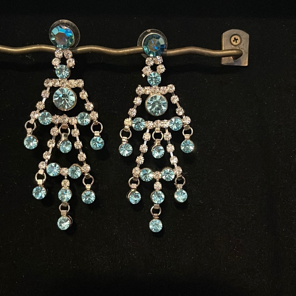 Blue and silver rhinestone artificial earrings.